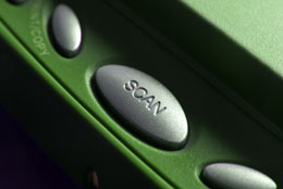 Close-up of a scanner's scan button